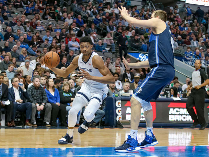 Mar 2, 2019; Dallas, TX, USA; Memphis Grizzlies forward Bruno Caboclo (5) drives to the basket around Dallas Mavericks forward Dirk Nowitzki (41) at American Airlines Center. Mandatory Credit: Andrew Dieb-USA TODAY Sports